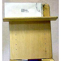 Atlas Standard book holder showing spring-loaded clip